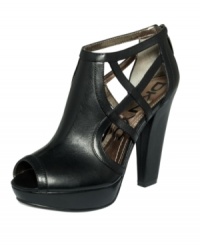 Towering with sexy side cut-outs. DKNYC's Hanna platform sandals give your outfit instant intrigue. Towering with sexy side cut-outs. DKNYC's Hanna platform sandals give your outfit instant intrigue.