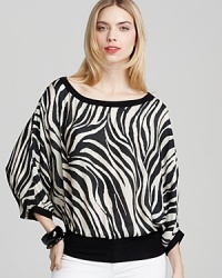 With a billowy silhouette and wild animal print, this Bailey 44 top goes from day to night in cutting-edge style. With a billowy silhouette and wild animal print, this Bailey 44 top goes from day to night in cutting-edge style.