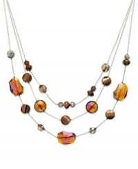 Layer on luxe loveliness with this three-row necklace from Style&co. Bronze and gold glass stones illuminate your look. Crafted in gold tone mixed metal. Approximate length: 18 inches + 2-inch extender. Layer on luxe loveliness with this three-row necklace from Style&co. Bronze and gold glass stones illuminate your look. Crafted in gold tone mixed metal. Approximate length: 18 inches + 2-inch extender.