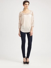 Metallic lace trim outlines this lengthy dolman top of ultra-soft modal. Wide roundneckButton frontDropped shouldersThree-quarter dolman sleevesBack contour hemMicro modalDry cleanMade in USAModel shown is 5'10 (177cm) wearing US size Small. Metallic lace trim outlines this lengthy dolman top of ultra-soft modal. Wide roundneckButton frontDropped shouldersThree-quarter dolman sleevesBack contour hemMicro modalDry cleanMade in USAModel shown is 5'10 (177cm) wearing US size Small.