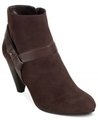 Cole Haan's Calico booties are decorated with metal hardware on the strap and feature a softly buffed outsole that's cushioned with Nike AIR technology. Cole Haan's Calico booties are decorated with metal hardware on the strap and feature a softly buffed outsole that's cushioned with Nike AIR technology.