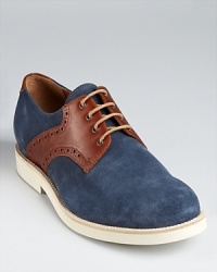 Saddle up your style with these classic, trend-right oxfords, featuring perforated leather detail and soft colored suede for a modern twist. Saddle up your style with these classic, trend-right oxfords, featuring perforated leather detail and soft colored suede for a modern twist.
