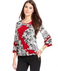Alfani's top looks regal with a luxe placed print and gemstone hue. Alfani's top looks regal with a luxe placed print and gemstone hue.