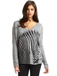 THE LOOKV-neckLong sleevesZebra graphicTHE FITAbout 27 from shoulder to longest part of hemTHE MATERIAL95% polyester/5% spandexCARE & ORIGINMachine washMade in USA THE LOOKV-neckLong sleevesZebra graphicTHE FITAbout 27 from shoulder to longest part of hemTHE MATERIAL95% polyester/5% spandexCARE & ORIGINMachine washMade in USA