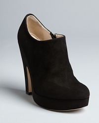 Jerome C. Rousseau takes his captivating design aesthetic into sensually shaped suede booties, with curves that make them standout. Jerome C. Rousseau takes his captivating design aesthetic into sensually shaped suede booties, with curves that make them standout.