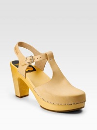 Buttery leather with cutouts and staple trim for an unexpected spin.Wooden heel, 3 (75mm) Wooden platform, ½(15mm) Compares to a 2½ heel (65mm) Leather lining Rubber sole Made in SwedenOUR FIT MODEL RECOMMENDS ordering true whole size; ½ sizes should order the next whole size up. Buttery leather with cutouts and staple trim for an unexpected spin.Wooden heel, 3 (75mm) Wooden platform, ½(15mm) Compares to a 2½ heel (65mm) Leather lining Rubber sole Made in SwedenOUR FIT MODEL RECOMMENDS ordering true whole size; ½ sizes should order the next whole size up.