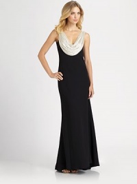 A shimmering beaded cowl neckline dresses up this elegant floor-length silhoeutte.Front and back beaded cowlSleevelessFlared skirtSilk liningAbout 47 from natural waistRayon/silkDry cleanImportedModel shown is 5'10½ (179cm) wearing US size 4. A shimmering beaded cowl neckline dresses up this elegant floor-length silhoeutte.Front and back beaded cowlSleevelessFlared skirtSilk liningAbout 47 from natural waistRayon/silkDry cleanImportedModel shown is 5'10½ (179cm) wearing US size 4.
