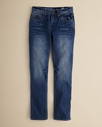 GUESS' slim fit Brit Rocker jean is rendered in Distance wash for an edgy denim look that creates a cool foundation for his casual wardrobe. GUESS' slim fit Brit Rocker jean is rendered in Distance wash for an edgy denim look that creates a cool foundation for his casual wardrobe.
