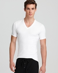Because it grips the body for a smooth, streamlined look, this V-neck boasts masculine appeal to complement your build. Because it grips the body for a smooth, streamlined look, this V-neck boasts masculine appeal to complement your build.