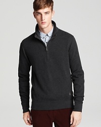 Burberry Brit's sleek half-zip pullover boasts comfort and classic style. Burberry Brit's sleek half-zip pullover boasts comfort and classic style.
