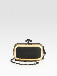 Luxurious leather with a metallic border and a convenient detachable strap.Detachable chain shoulder strap, 24½ dropTop clasp closureSuede lining7¼W X 4¼H X ¾DMade in Italy Luxurious leather with a metallic border and a convenient detachable strap.Detachable chain shoulder strap, 24½ dropTop clasp closureSuede lining7¼W X 4¼H X ¾DMade in Italy