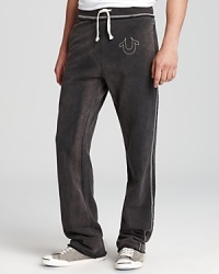 The rugged distressed look lends a harder edge to these laid-back sweatpants from True Religion, an easy grab-and-go option that's always there when you need it. The rugged distressed look lends a harder edge to these laid-back sweatpants from True Religion, an easy grab-and-go option that's always there when you need it.