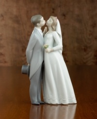 In Spain's renowned Lladró workshops, talented artisans create porcelain sculptures of the highest artistic and technical quality. This Lladró creation is made of fine porcelain, handpainted and glazed to express a special moment. Stands 7-1/2 tall. In Spain's renowned Lladró workshops, talented artisans create porcelain sculptures of the highest artistic and technical quality. This Lladró creation is made of fine porcelain, handpainted and glazed to express a special moment. Stands 7-1/2 tall.