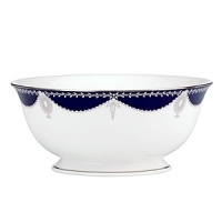 Embellished with raised enamel dots and finished with gleaming platinum, this grand serving bowl from Marchesa by Lenox brings the designer's opulently beaded bridal dresses to the world of fine dining.