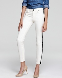 A new take on black-tie, these uniquely-detailed Sanctuary jeans mix sought-after skinny denim style with a classic tuxedo pant. A new take on black-tie, these uniquely-detailed Sanctuary jeans mix sought-after skinny denim style with a classic tuxedo pant.