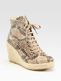 Classic ankle-grazing silhouette modernized by a snake-print faux leather upper, lace-up front and an espadrille wedge. Braided hemp wedge, 4 (100mm)Braided hemp platform, 1 (25mm)Compares to a 3 heel (75mm)Snake-print faux leather and burlap upperFaux leather liningRubber solePadded insoleMade in SpainOUR FIT MODEL RECOMMENDS ordering true whole size; ½ sizes should order the next whole size up. Classic ankle-grazing silhouette modernized by a snake-print faux leather upper, lace-up front and an espadrille wedge. Braided hemp wedge, 4 (100mm)Braided hemp platform, 1 (25mm)Compares to a 3 heel (75mm)Snake-print faux leather and burlap upperFaux leather liningRubber solePadded insoleMade in SpainOUR FIT MODEL RECOMMENDS ordering true whole size; ½ sizes should order the next whole size up.