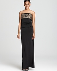 This Laundry by Shelli Segal dress makes a statuesque appearance in a strapless column silhouette, detailed with metallic and jeweled accents. This Laundry by Shelli Segal dress makes a statuesque appearance in a strapless column silhouette, detailed with metallic and jeweled accents.