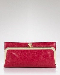 Deluxe double duty: Hobo's trifold wallet stashes your cash with chic ease and works overtime as a colorful clutch when the sun goes down.