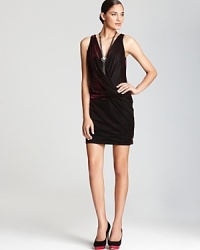 Aqua's lush velvet dress shifts from black to fuchsia with every step, shimmering in a sleeveless faux wrap silhouette. Aqua's lush velvet dress shifts from black to fuchsia with every step, shimmering in a sleeveless faux wrap silhouette.