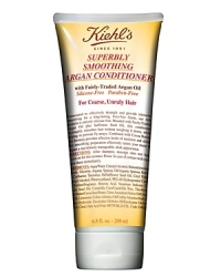 Formulated with fairly-traded Argan Oil and Safflower Oil, our conditioner moisturizes, detangles, and provides intensive smoothing and longlasting shine with a frizz-free finish. Silicone and Paraben-Free Formula. Effectively smooths hair without weighing it down, while preventing frizz and fly-aways. Formula also contains emollient Cocoa Butter to add moisture and shine. Imparts a sleeker, more manageable look and feel to hair. Shampoo with Kiehl's Superbly Smoothing Argan Shampoo. Rinse and apply a generous amount of conditioner to hair, especially the ends. Gently work through the hair and leave on for two to three minutes. Rinse with lukewarm water. Style as usual. Formulated with fairly-traded Argan Oil and Safflower Oil, our conditioner moisturizes, detangles, and provides intensive smoothing and longlasting shine with a frizz-free finish. Silicone and Paraben-Free Formula. Effectively smooths hair without weighing it down, while preventing frizz and fly-aways. Formula also contains emollient Cocoa Butter to add moisture and shine. Imparts a sleeker, more manageable look and feel to hair. Shampoo with Kiehl's Superbly Smoothing Argan Shampoo. Rinse and apply a generous amount of conditioner to hair, especially the ends. Gently work through the hair and leave on for two to three minutes. Rinse with lukewarm water. Style as usual.
