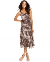 Jessica Howard's petite dress features a flowing silhouette enlivened with an animal-inspired mixed print and beading at the neckline. Jessica Howard's petite dress features a flowing silhouette enlivened with an animal-inspired mixed print and beading at the neckline.