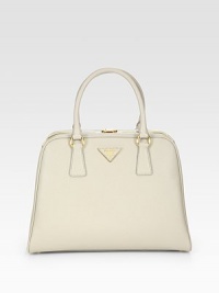 Saffiano leather in a frame-top carryall with metal logo lettering.Double top handles, 5¼ dropTop clasp closureProtective metal feetTwo inside zip pocketsThree inside open pocketsLeather lining12¾W X 9¾H X 3¾DMade in Italy Saffiano leather in a frame-top carryall with metal logo lettering.Double top handles, 5¼ dropTop clasp closureProtective metal feetTwo inside zip pocketsThree inside open pocketsLeather lining12¾W X 9¾H X 3¾DMade in Italy