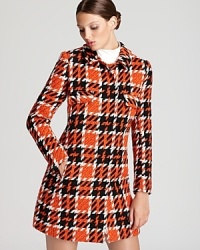 Designed to stand out, a houndstooth-print RAOUL coat touts a vibrant palette and masculine silhouette for modern impact. Designed to stand out, a houndstooth-print RAOUL coat touts a vibrant palette and masculine silhouette for modern impact.