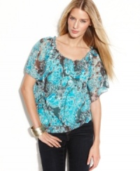 A painterly paisley print on a petite peasant silhouette pairs perfectly with bright white bottoms or skinny-leg dark denim. A painterly paisley print on a petite peasant silhouette pairs perfectly with bright white bottoms or skinny-leg dark denim.
