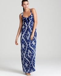 A bold batik print brings a global spirit to this Rebecca Taylor maxi dress, finished with a neat tie at the bust. A bold batik print brings a global spirit to this Rebecca Taylor maxi dress, finished with a neat tie at the bust.