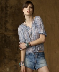 An airy peasant top in lightweight mesh captures a soft flower-child sensibility with romantic smocking, a chic floral print and self-ties at the shoulders for a feminine, modern touch. An airy peasant top in lightweight mesh captures a soft flower-child sensibility with romantic smocking, a chic floral print and self-ties at the shoulders for a feminine, modern touch.