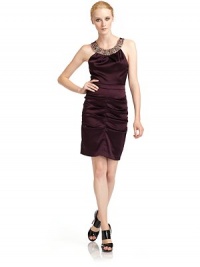THE LOOKJewel-embellished circle necklineSleevelessGathered pleats at bodiceSet-in waistRuched skirtCenter back zipperTHE FITAbout 37 from shoulder to hemTHE MATERIAL64% acetate/33% nylon/3% spandexFully linedCARE & ORIGINDry cleanMade in USA THE LOOKJewel-embellished circle necklineSleevelessGathered pleats at bodiceSet-in waistRuched skirtCenter back zipperTHE FITAbout 37 from shoulder to hemTHE MATERIAL64% acetate/33% nylon/3% spandexFully linedCARE & ORIGINDry cleanMade in USA