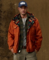 Leaving its heritage behind, an essential raincoat is reenvisioned for the modern man with rugged cargo-style pockets and a bright tribal-print lining. Leaving its heritage behind, an essential raincoat is reenvisioned for the modern man with rugged cargo-style pockets and a bright tribal-print lining.