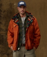 Leaving its heritage behind, an essential raincoat is reenvisioned for the modern man with rugged cargo-style pockets and a bright tribal-print lining.