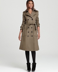 A Burberry London wool and cashmere trench coat touts a lush shearling collar for sumptuous style through the cold weather season. A Burberry London wool and cashmere trench coat touts a lush shearling collar for sumptuous style through the cold weather season.