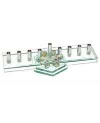 Combine Hanukkah candle lighting and dreidel fun with one festive menorah. A row of silvertone metal candle holders set in glass and perched on six colorful tops raises everyone's spirits for eight days straight. Combine Hanukkah candle lighting and dreidel fun with one festive menorah. A row of silvertone metal candle holders set in glass and perched on six colorful tops raises everyone's spirits for eight days straight.