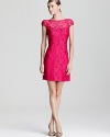 An eye-catching hue pops on this Theia cocktail dress, fashioned in delicate lace for a romantic finish.