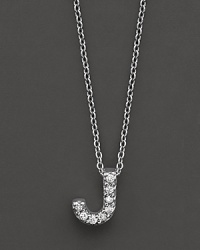 From the Tiny Treasures collection, a diamond J necklace. With signature ruby accent. Designed by Roberto Coin. From the Tiny Treasures collection, a diamond J necklace. With signature ruby accent. Designed by Roberto Coin.
