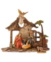 Mary and Joseph welcome baby Jesus into the world in this beautifully crafted nativity scene from Mark Roberts. An angel figure presides over them proclaiming, Gloria.