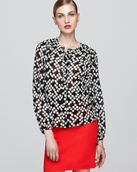 Rendered in luxe stretch silk, this graphic-print Trina Turk top is a bold yet ladylike addition to your work portfolio. Rendered in luxe stretch silk, this graphic-print Trina Turk top is a bold yet ladylike addition to your work portfolio.