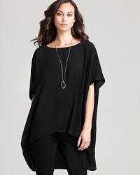 A mastery in modern design, this Eileen Fisher top goes strikingly oversize with a fluid silk body and high/low hemline for effortless urban edge. A mastery in modern design, this Eileen Fisher top goes strikingly oversize with a fluid silk body and high/low hemline for effortless urban edge.