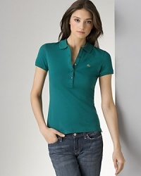 A hail to classic sportswear, this short-sleeve Lacoste polo shirt infuses your off-duty wardrobe with timeless appeal. Give it a new season spin with printed pants. A hail to classic sportswear, this short-sleeve Lacoste polo shirt infuses your off-duty wardrobe with timeless appeal. Give it a new season spin with printed pants.