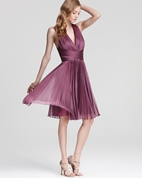 In a deep, floral hue, Halston Heritage's romantic halter dress lends a delicate look with intricate pleating. In a deep, floral hue, Halston Heritage's romantic halter dress lends a delicate look with intricate pleating.