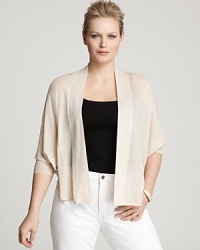 The relaxed, open styling of this draped Eileen Fisher cardigan lends itself to layering, topping your closet favorites with luxe lightweight warmth. The relaxed, open styling of this draped Eileen Fisher cardigan lends itself to layering, topping your closet favorites with luxe lightweight warmth.