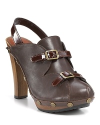 Glossy patent trim and scalloped accents lend ladylike appeal to these See by Chloé clogs. Glossy patent trim and scalloped accents lend ladylike appeal to these See by Chloé clogs.