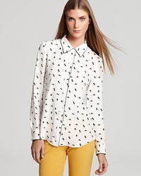 A whimsical bird print enriches this elegant Theory top crafted from pure silk. A whimsical bird print enriches this elegant Theory top crafted from pure silk.