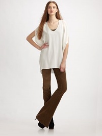 Oversized construction adds a draped feel to this pure silk style. V-neck Split dolman sleeves Hi-low hem Silk Dry clean Imported Oversized construction adds a draped feel to this pure silk style. V-neck Split dolman sleeves Hi-low hem Silk Dry clean Imported
