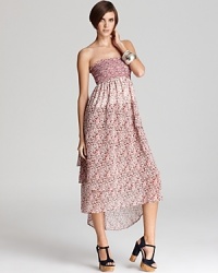This floral Patterson J. Kincaid strapless dress transforms into a flowing maxi skirt for ultimate chicness and versatility. This floral Patterson J. Kincaid strapless dress transforms into a flowing maxi skirt for ultimate chicness and versatility.