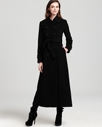 DKNY's timeless black coat exudes elegance with cosmopolitan sensibility. DKNY's timeless black coat exudes elegance with cosmopolitan sensibility.