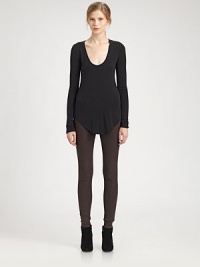 From the HELMUT capsule collection. Edgy elegance in its truest form, this modal-rich top has a plunging scoopneck and shirttail hem that hits below the hips. ScoopneckLong sleevesShirttail hem hits below the hipsAbout 27 from shoulder to hem at longest pointModal/wool/spandexDry cleanMade in USA of Canadian fabricModel shown is 5'9 (176cm) wearing US size Small.