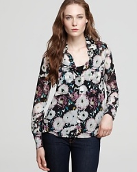 A lively floral print blooms upon this elegant silk button down. A lively floral print blooms upon this elegant silk button down.